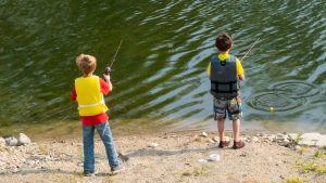 Boys fishing on the shore